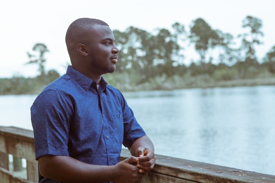Person listening attentively during a conversation outdoors