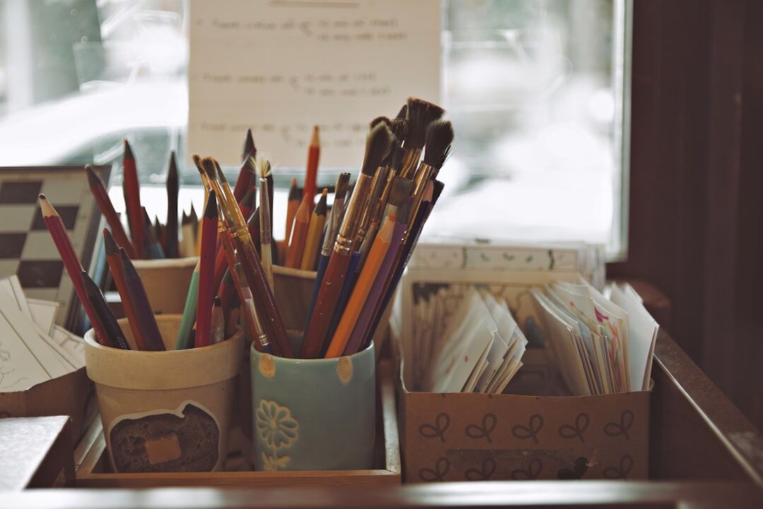 Cozy writing studio with notebooks, plants and warm light