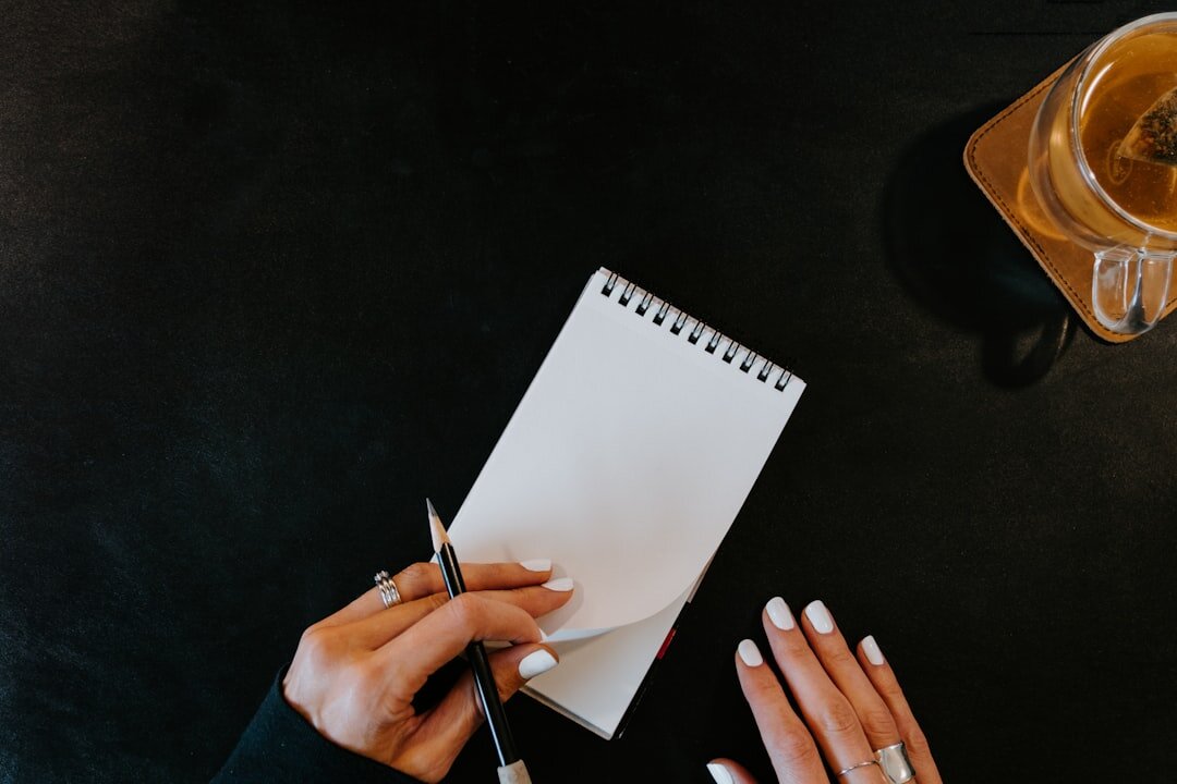 person journaling at desk