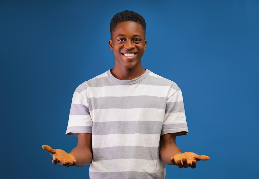 Person speaking confidently while gesturing with open hands